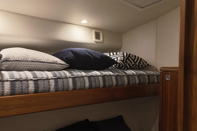 Slide: The Image of Cozy cabin interior of 2020 Hatteras GT45X yacht with stylish bedding and pillows. - 57