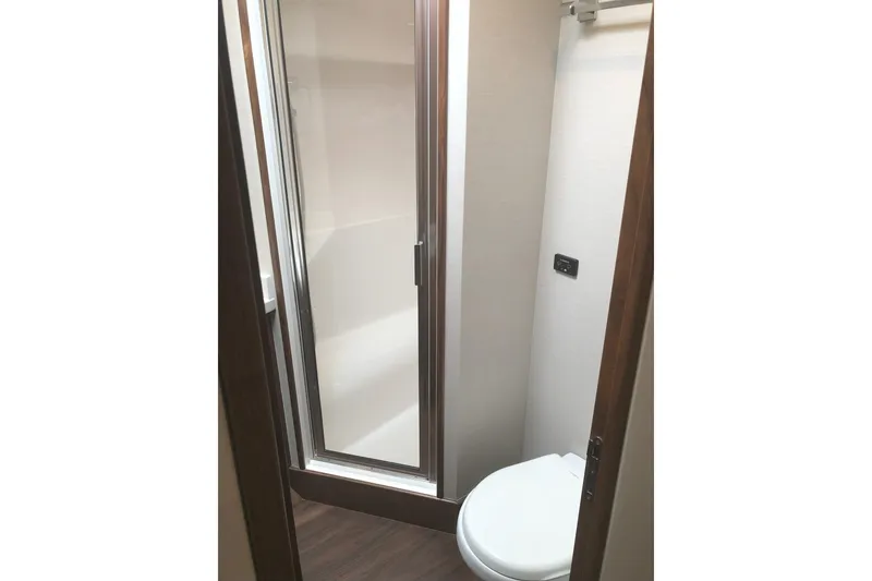 Slide: The Image of 2020 Hatteras GT45X yacht bathroom with shower and toilet. - 60