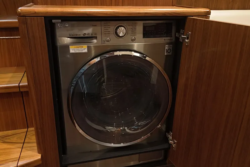 Slide: The Image of LG washer in wooden cabinet on 2020 Hatteras GT45X yacht. - 64