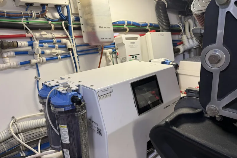 Slide: The Image of Engine room of 2020 Hatteras GT45X yacht with advanced filtration system. - 68