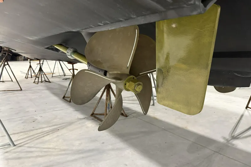 Slide: The Image of 2020 Hatteras GT45X boat propeller and rudder in dry dock. - 72