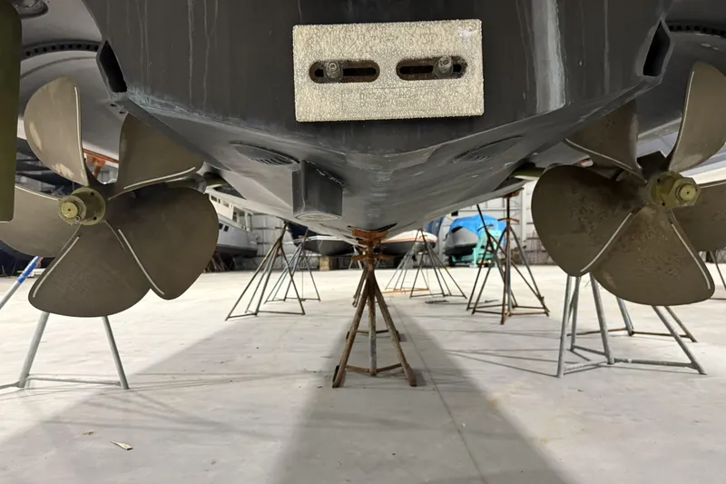 Slide: The Image of 2020 Hatteras GT45X yacht propellers and hull in dry dock. - 73