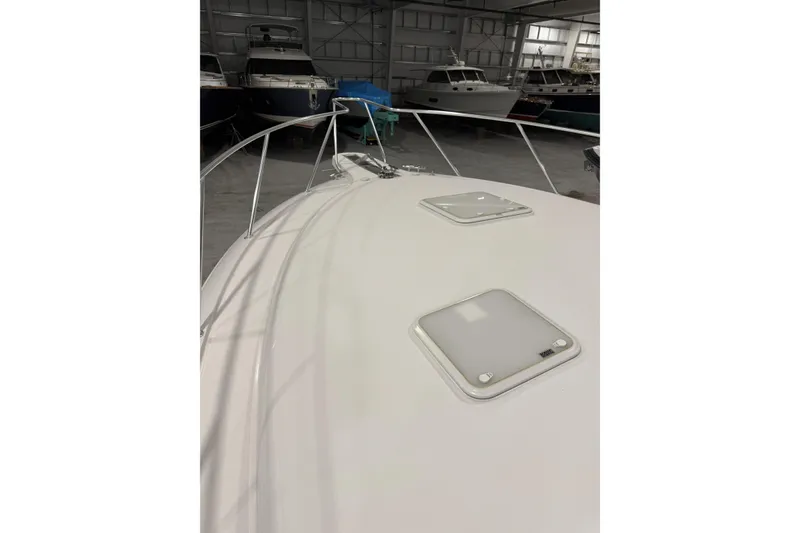 Slide: The Image of 2020 Hatteras GT45X yacht bow in indoor storage facility. - 77
