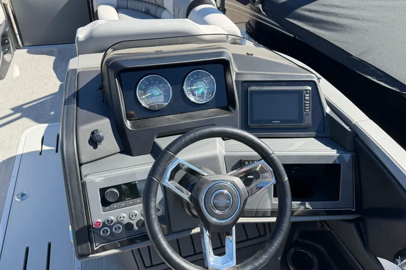 Slide: The Image of Steering console of 2026 Avalon Catalina Entertainer boat with gauges and controls. - 5