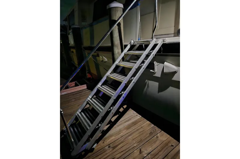 Slide: The Image of Kitchen interior of 1984 Hatteras 61 Cockpit MY with stainless steel refrigerator. - 10