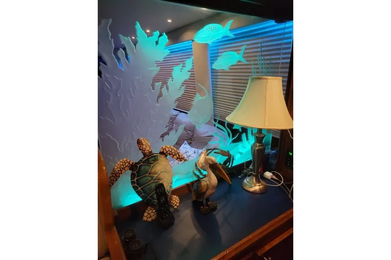 Slide: The Image of Luxurious interior of 1984 Hatteras 61 Cockpit MY yacht with cozy seating and ambient lighting. - 14