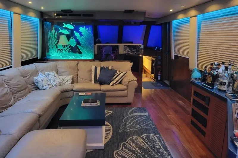 Slide: The Image of Luxurious 1984 Hatteras 61 Cockpit MY yacht deck with elegant seating and ambient lighting. - 16