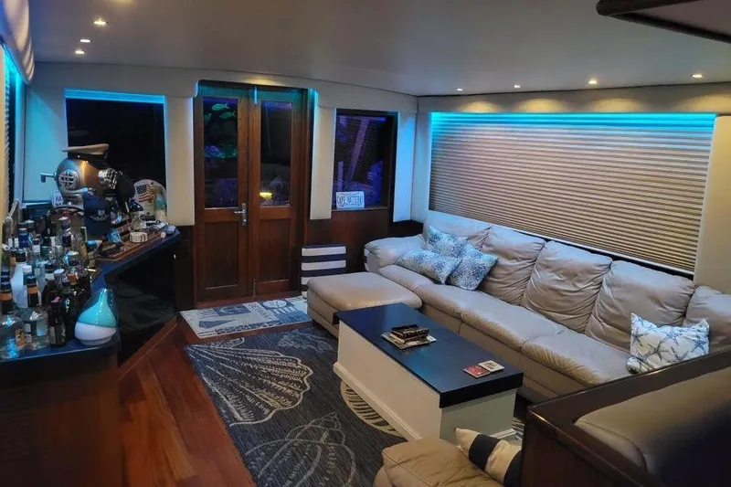Slide: The Image of Luxurious interior of 1984 Hatteras 61 Cockpit MY with aquarium and bar setup. - 17