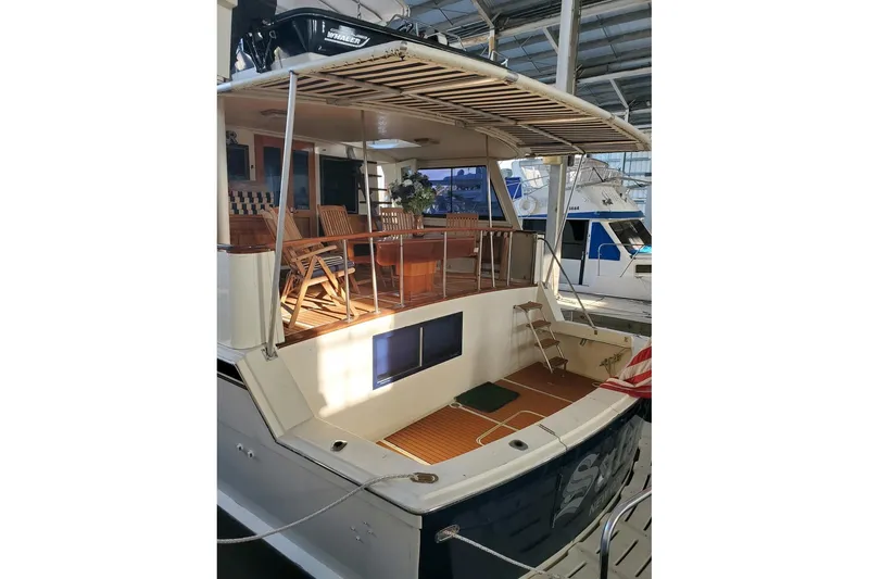 Slide: The Image of Cozy twin beds in 1984 Hatteras 61 Cockpit MY yacht cabin with heater and decor. - 20