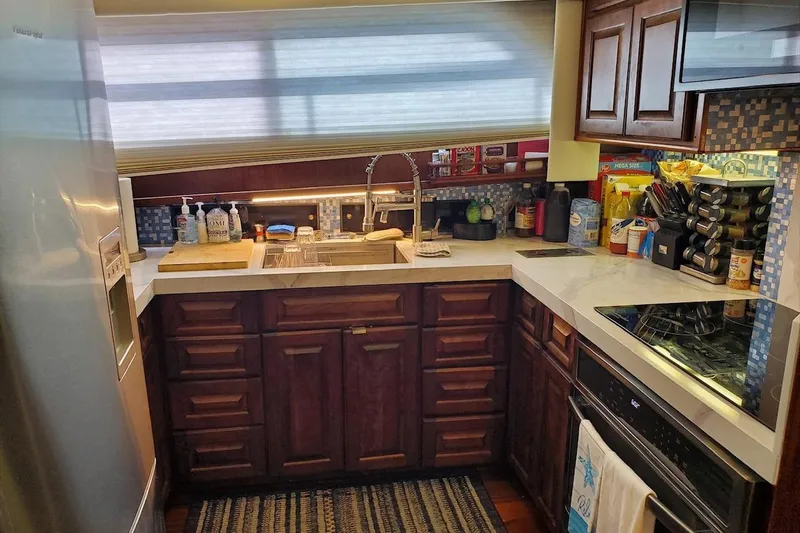 Slide: The Image of 1984 Hatteras 61 Cockpit MY yacht with spacious deck and seating area. - 25