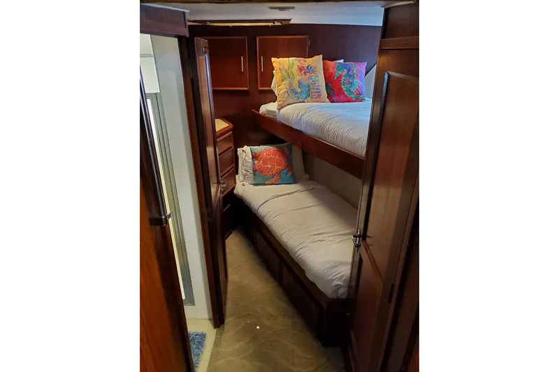 Slide: The Image of 1984 Hatteras 61 Cockpit MY yacht with wooden deck, docked at marina. - 27