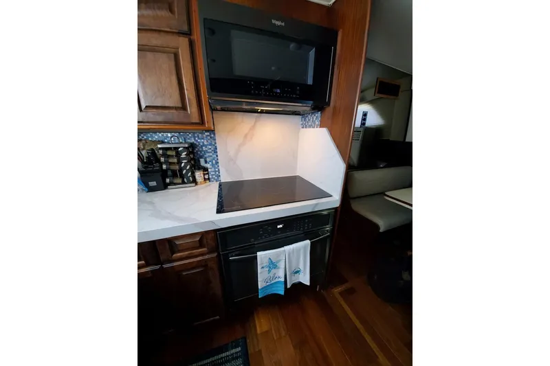 Slide: The Image of 1984 Hatteras 61 Cockpit MY yacht with wooden deck and seating area. - 31