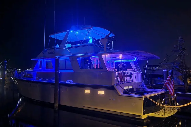 Slide: The Image of Luxurious interior of 1984 Hatteras 61 Cockpit MY yacht with cozy seating and ambient lighting. - 35