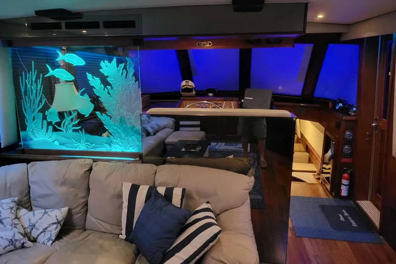 Slide: The Image of Luxurious interior of 1984 Hatteras 61 Cockpit MY yacht with cozy seating and ambient lighting. - 37