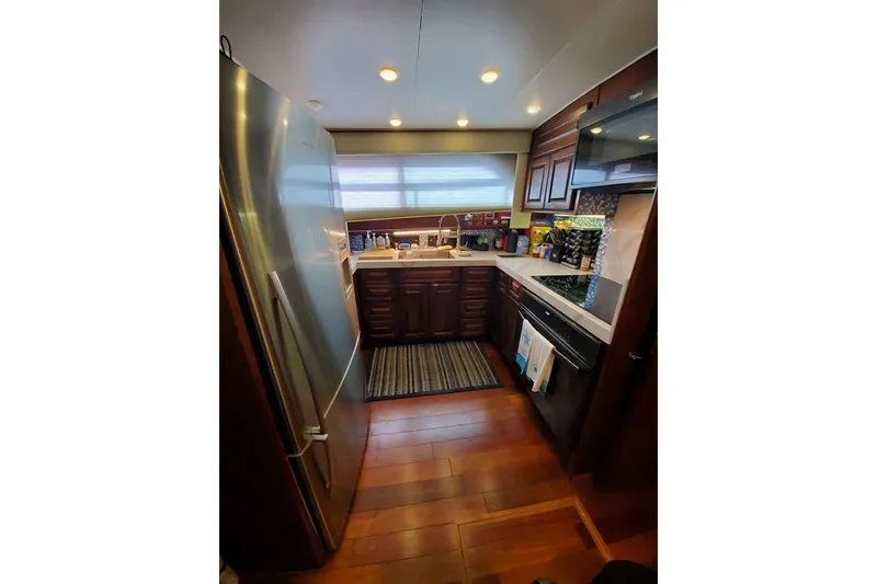 Slide: The Image of Bathroom interior of 1984 Hatteras 61 Cockpit MY yacht with wooden sink and modern fixtures. - 5