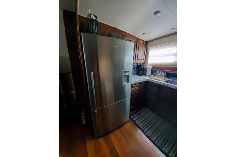 Slide: The Image of Interior of 1984 Hatteras 61 Cockpit MY yacht with red ambient lighting. - 9