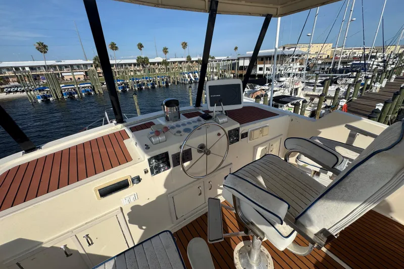 Slide: The Image of Cockpit view of 1984 Hatteras 61 Cockpit MY yacht at marina. - 47