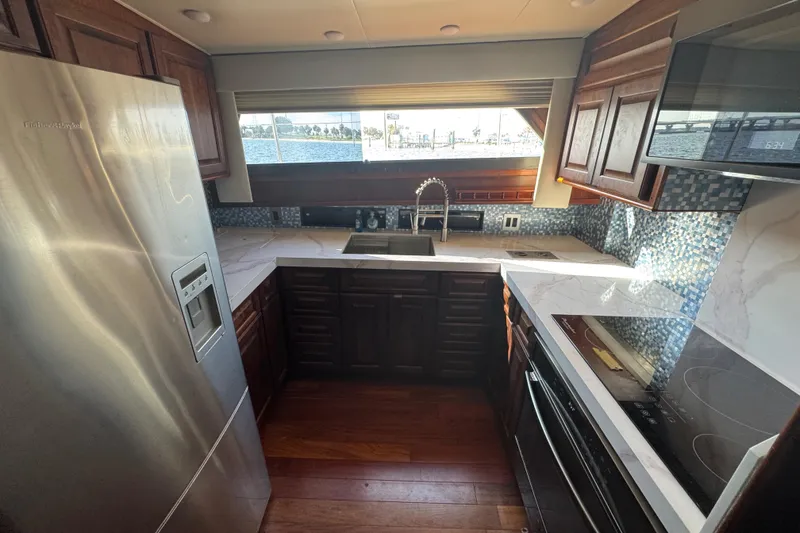 Slide: The Image of Modern kitchen interior on 1984 Hatteras 61 Cockpit MY yacht with stainless steel appliances. - 44