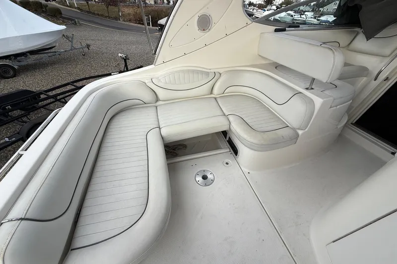 Slide: The Image of 2004 Maxum 3100 SE boat interior with white leather seating and modern design. - 3