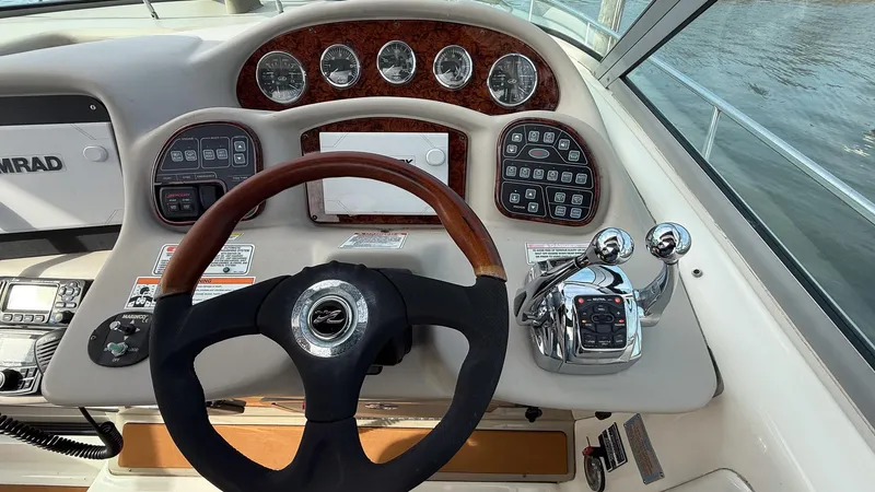 Slide: The Image of Helm of 2008 Sea Ray 340 Sundancer with steering wheel and control panel. - 16