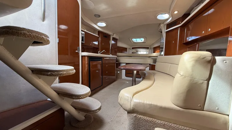 Slide: The Image of Interior of 2008 Sea Ray 340 Sundancer yacht with elegant seating and modern amenities. - 22