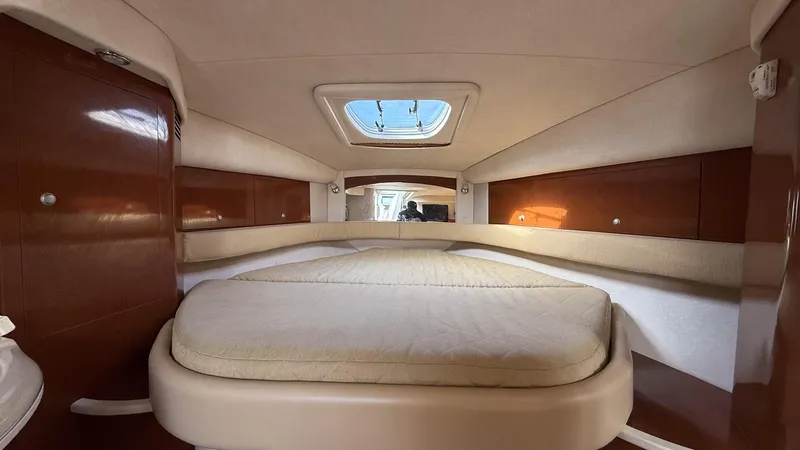 Slide: The Image of 2008 Sea Ray 340 Sundancer cabin interior with bed and skylight. - 26