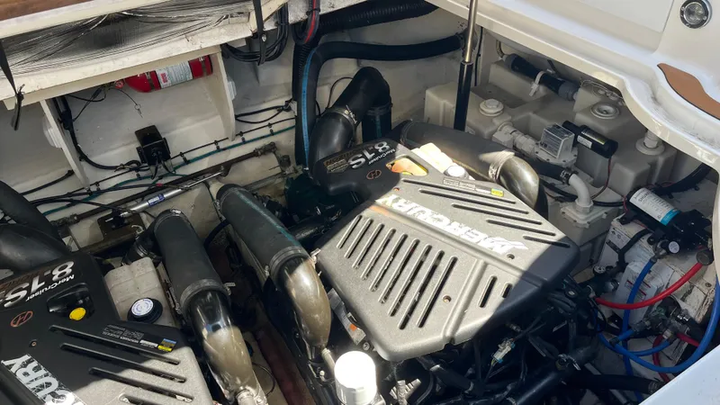 Slide: The Image of Engine compartment of a 2008 Sea Ray 340 Sundancer boat, showcasing dual SL8 engines. - 30