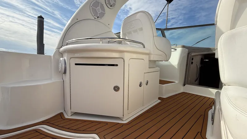 Slide: The Image of 2008 Sea Ray 340 Sundancer interior with sleek seating and wood flooring. - 6