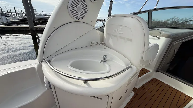 Slide: The Image of 2008 Sea Ray 340 Sundancer boat interior with sink and seating area. - 9