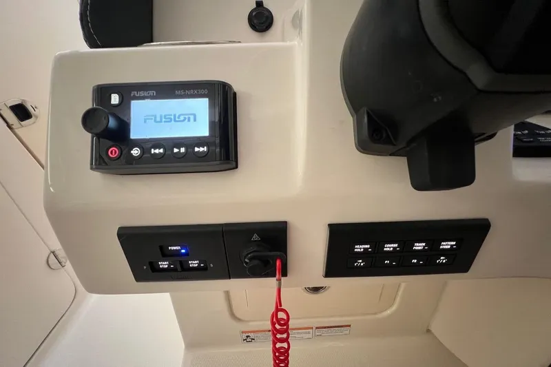 Slide: The Image of Control panel of 2023 Grady-White Freedom 275 boat with Fusion audio system. - 12