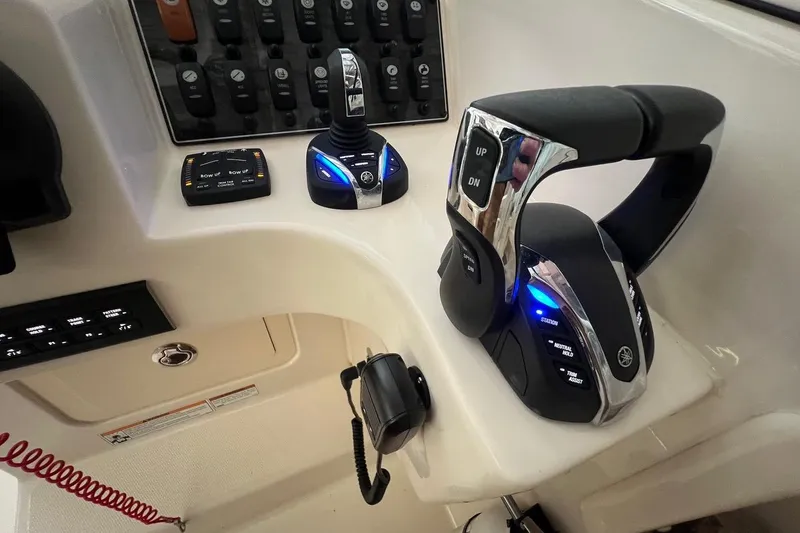 Slide: The Image of Control panel of 2023 Grady-White Freedom 275 boat with advanced throttle system. - 14