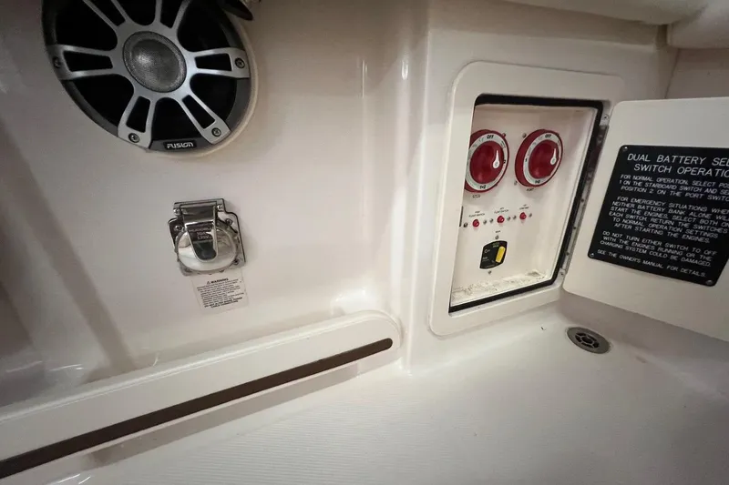 Slide: The Image of 2023 Grady-White Freedom 275 boat interior with battery switch panel and speaker. - 19