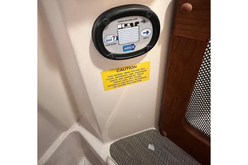 Slide: The Image of Control panel and caution sign on 2023 Grady-White Freedom 275 boat. - 22