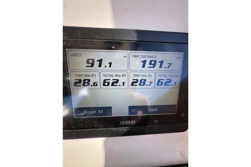 Slide: The Image of Yamaha display showing fuel usage and trip data on 2023 Grady-White Freedom 275 boat. - 23