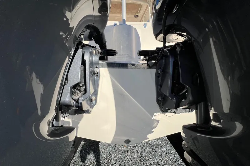 Slide: The Image of 2023 Grady-White Freedom 275 boat engines, close-up view of dual outboard motors. - 27