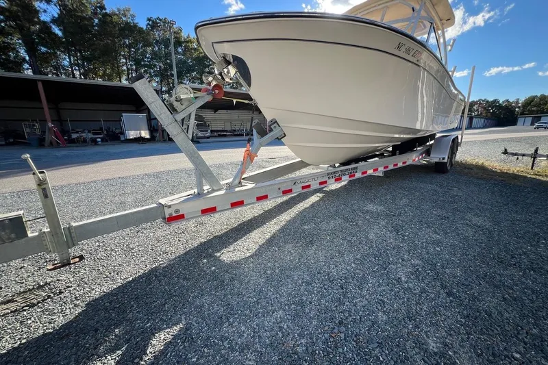 Slide: The Image of 2023 Grady-White Freedom 275 boat on trailer in outdoor storage area. - 34