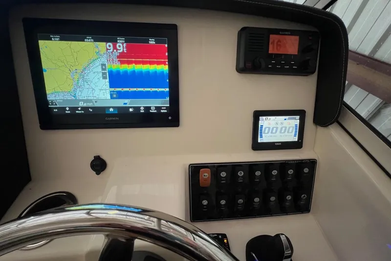Slide: The Image of Dashboard of 2023 Grady-White Freedom 275 with Garmin navigation system. - 8
