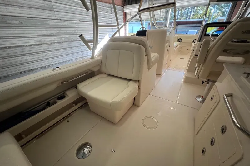 Slide: The Image of 2023 Grady-White Freedom 275 boat interior with luxurious seating and modern design. - 9