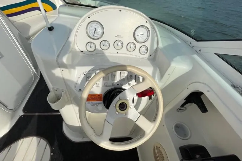 Slide: The Image of Steering console of a 2000 Baha MACH 1 boat with gauges and controls. - 10