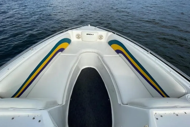 Slide: The Image of Bow of a 2000 Baha MACH 1 boat with colorful interior design on the water. - 15