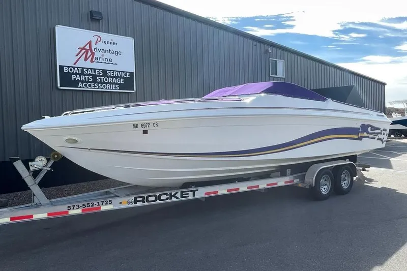 Slide: The Image of 2000 Baha MACH 1 boat on trailer at Premier Advantage Marine dealership. - 2
