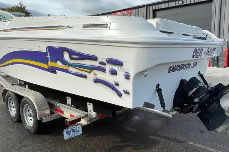 Slide: The Image of 2000 Baha MACH 1 boat on trailer, vibrant purple and yellow graphics, Camdenton, MO. - 9