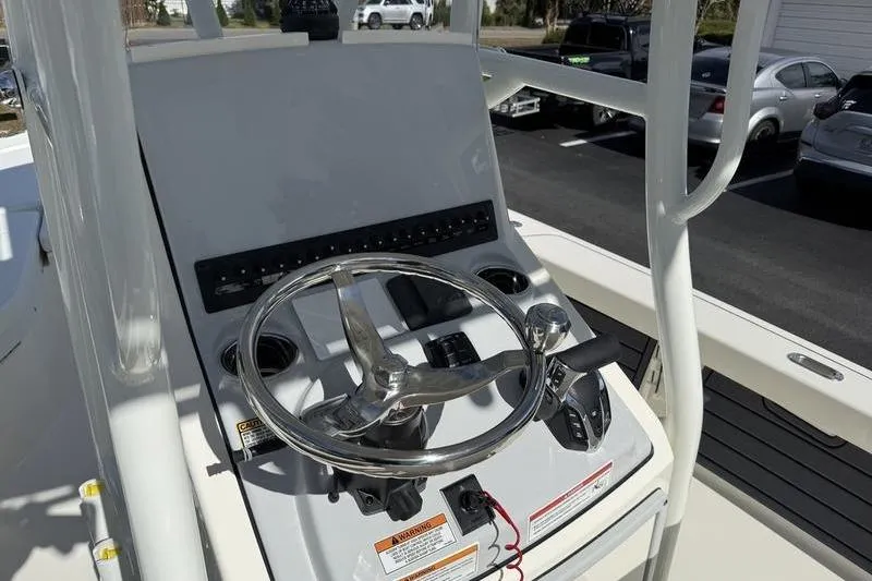 Slide: The Image of 2026 Pathfinder 2200 TRS boat console with steering wheel and controls. - 15