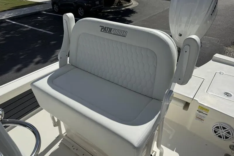 Slide: The Image of 2026 Pathfinder 2200 TRS boat seat with white upholstery and logo. - 18