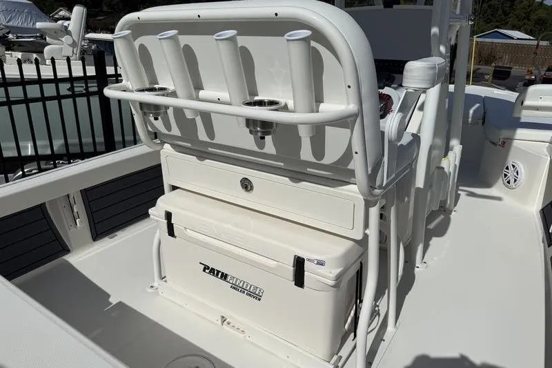 Slide: The Image of 2026 Pathfinder 2200 TRS boat interior with rod holders and storage compartment. - 19