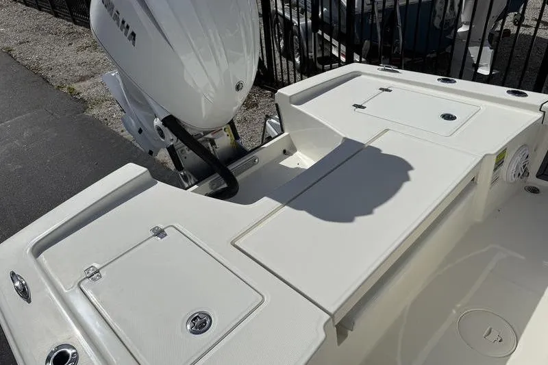 Slide: The Image of 2026 Pathfinder 2200 TRS boat deck with Yamaha outboard motor, featuring storage compartments. - 20