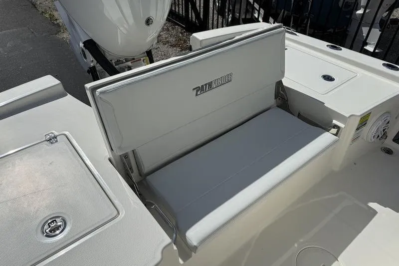 Slide: The Image of 2026 Pathfinder 2200 TRS boat seating area with engine in background. - 21