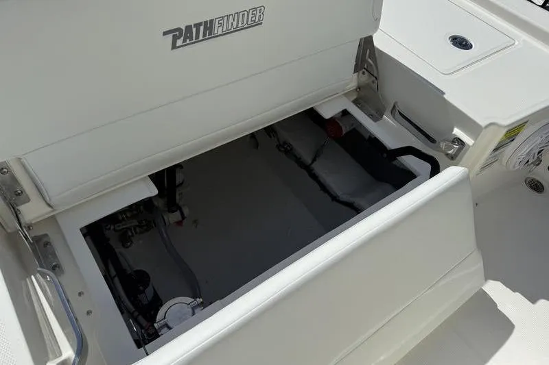 Slide: The Image of Open storage compartment on 2026 Pathfinder 2200 TRS boat, showcasing interior details. - 23