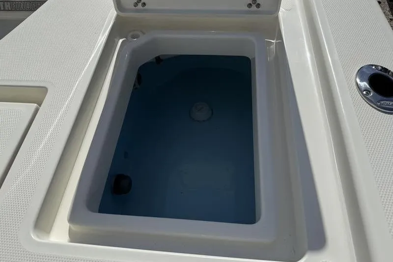 Slide: The Image of Livewell compartment on a 2026 Pathfinder 2200 TRS boat, filled with water. - 25