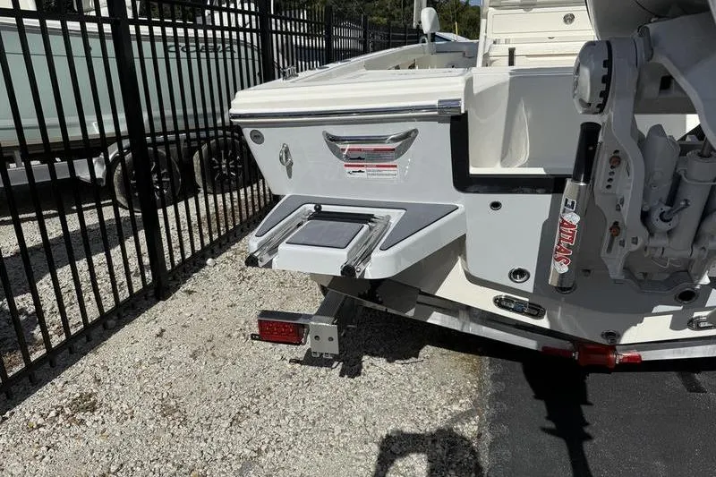 Slide: The Image of 2026 Pathfinder 2200 TRS boat rear view with swim platform and motor mount. - 27